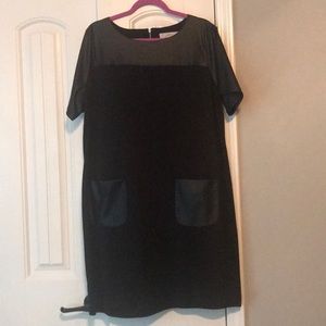 Black dress with leather sleeves and pockets